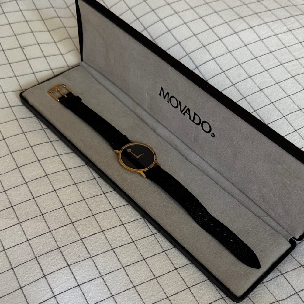 Movado Classic Black and Gold Timepiece